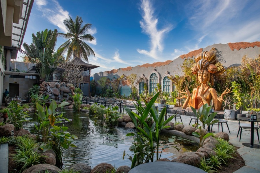 Koi pond and tropical courtyard by day